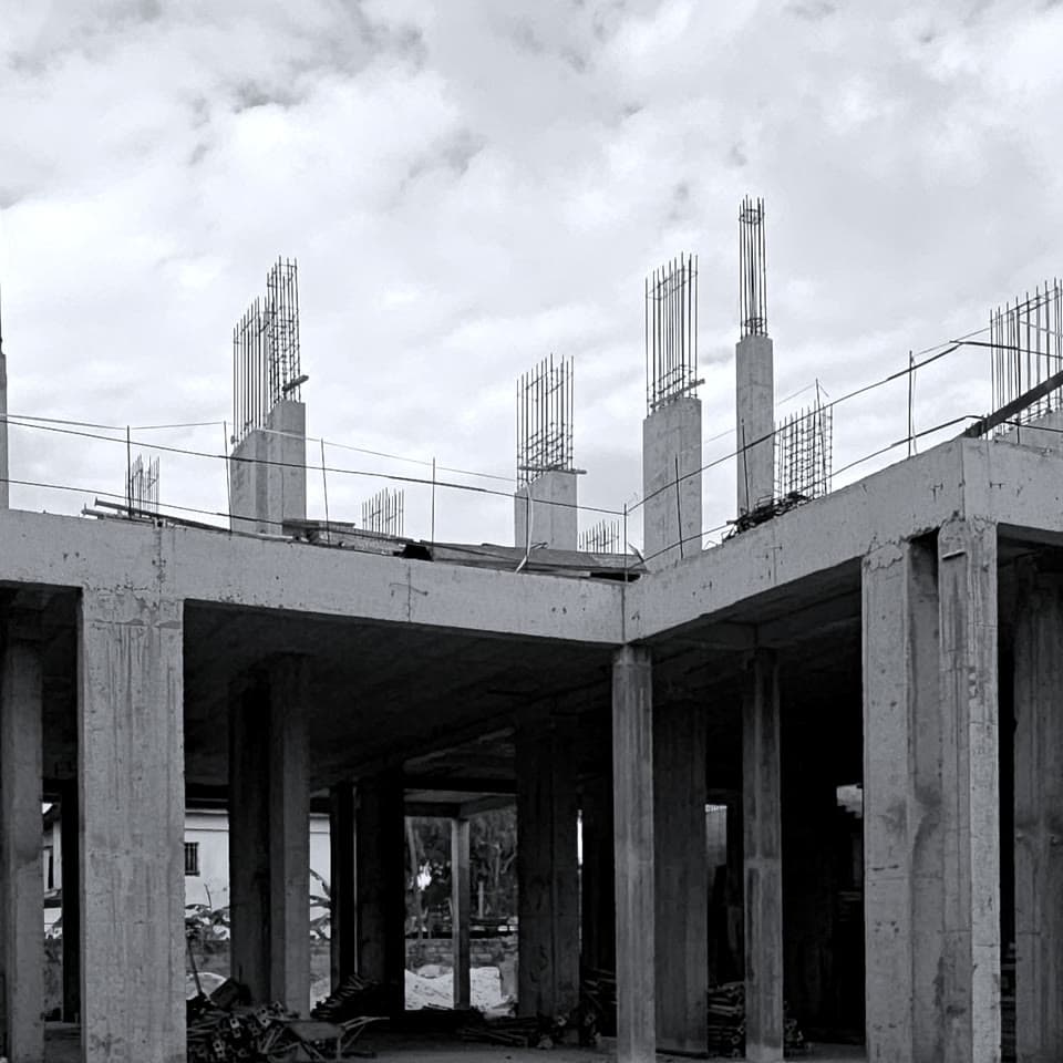 Platinum Tower on 28 September 2026: the ground floor framed in reinforced concrete, with column steel standing on the first slab