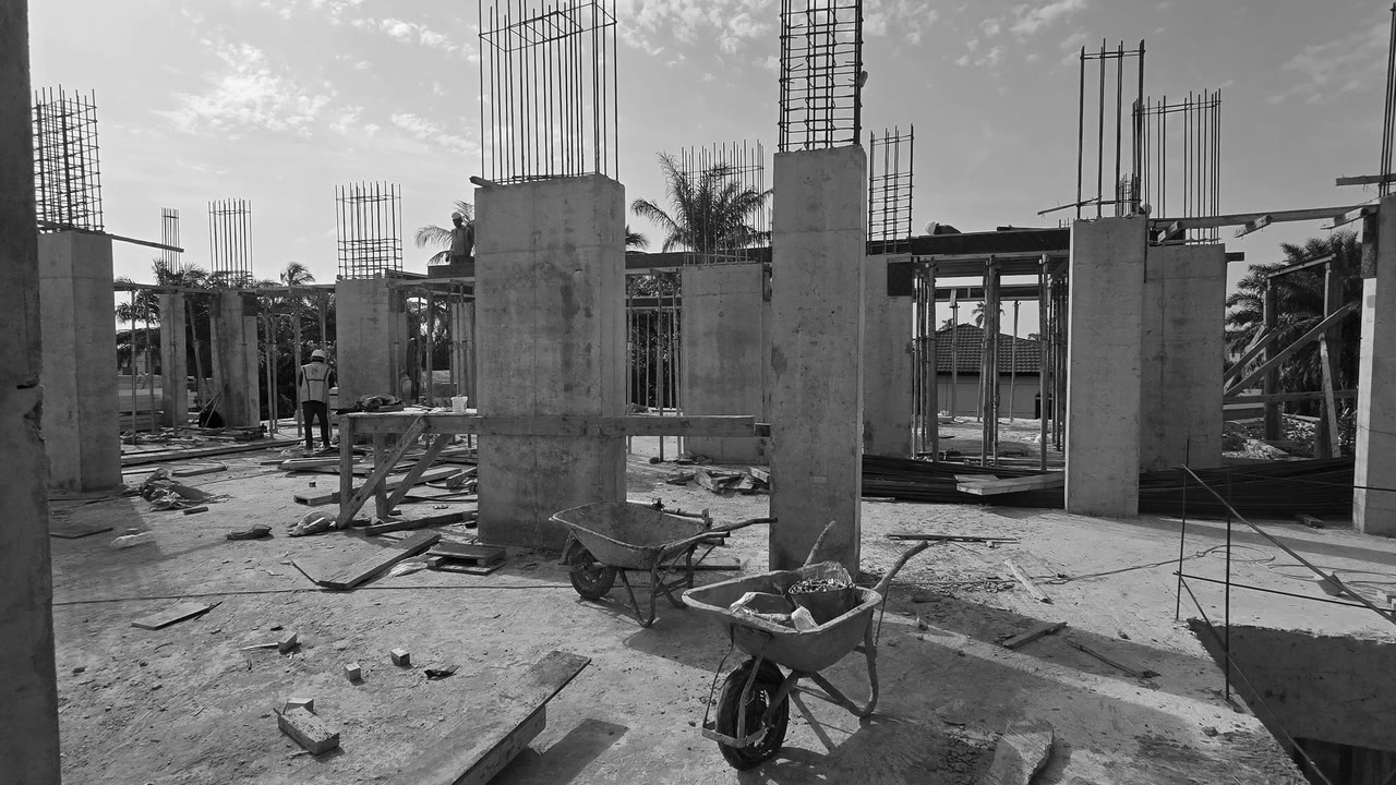 The Platinum Tower deck on 17 October 2026: columns cast, wheelbarrows and formwork on site