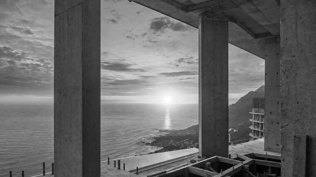 Concrete columns framing the ocean during construction