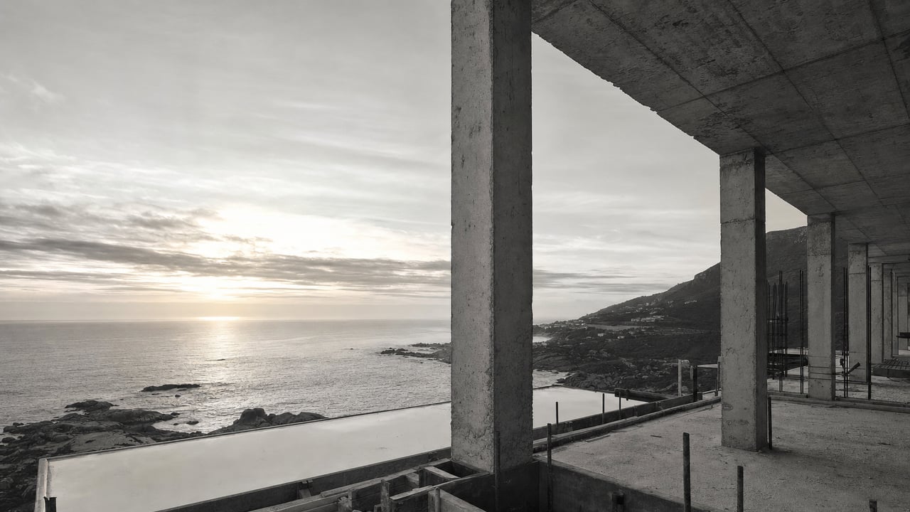 Concrete columns framing the ocean during construction
