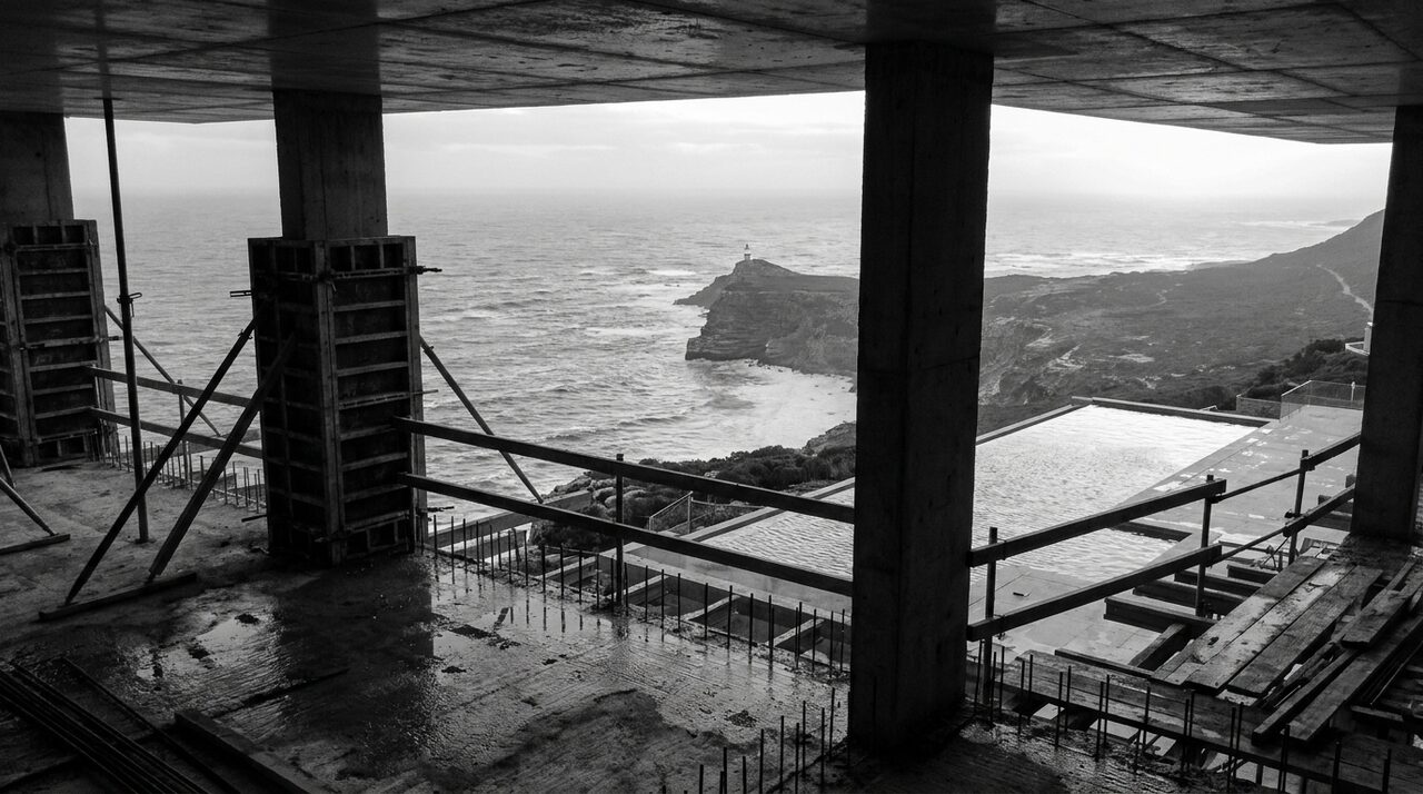 Concrete columns framing the ocean during construction