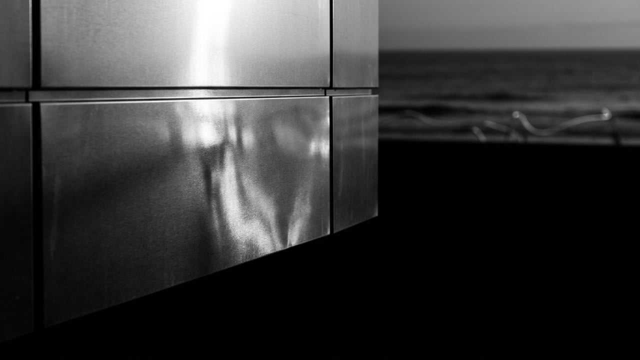 Facade detail in silver light over the ocean