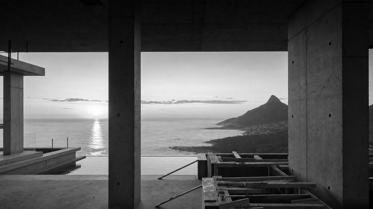 Concrete columns framing the ocean during construction