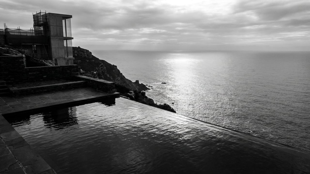 Infinity pool edge meeting the ocean horizon